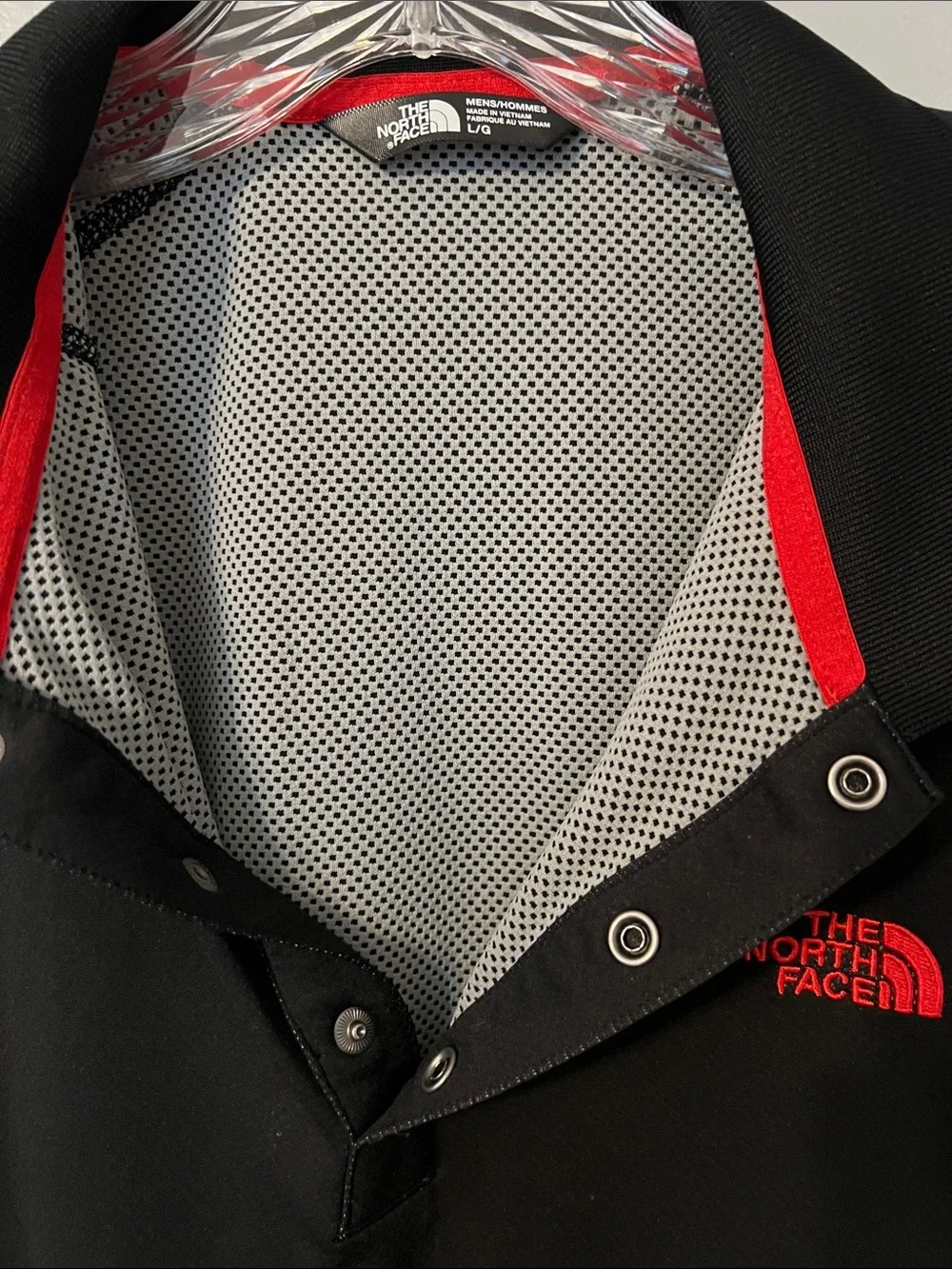 The North Face Black Polo with Red Logo Accent